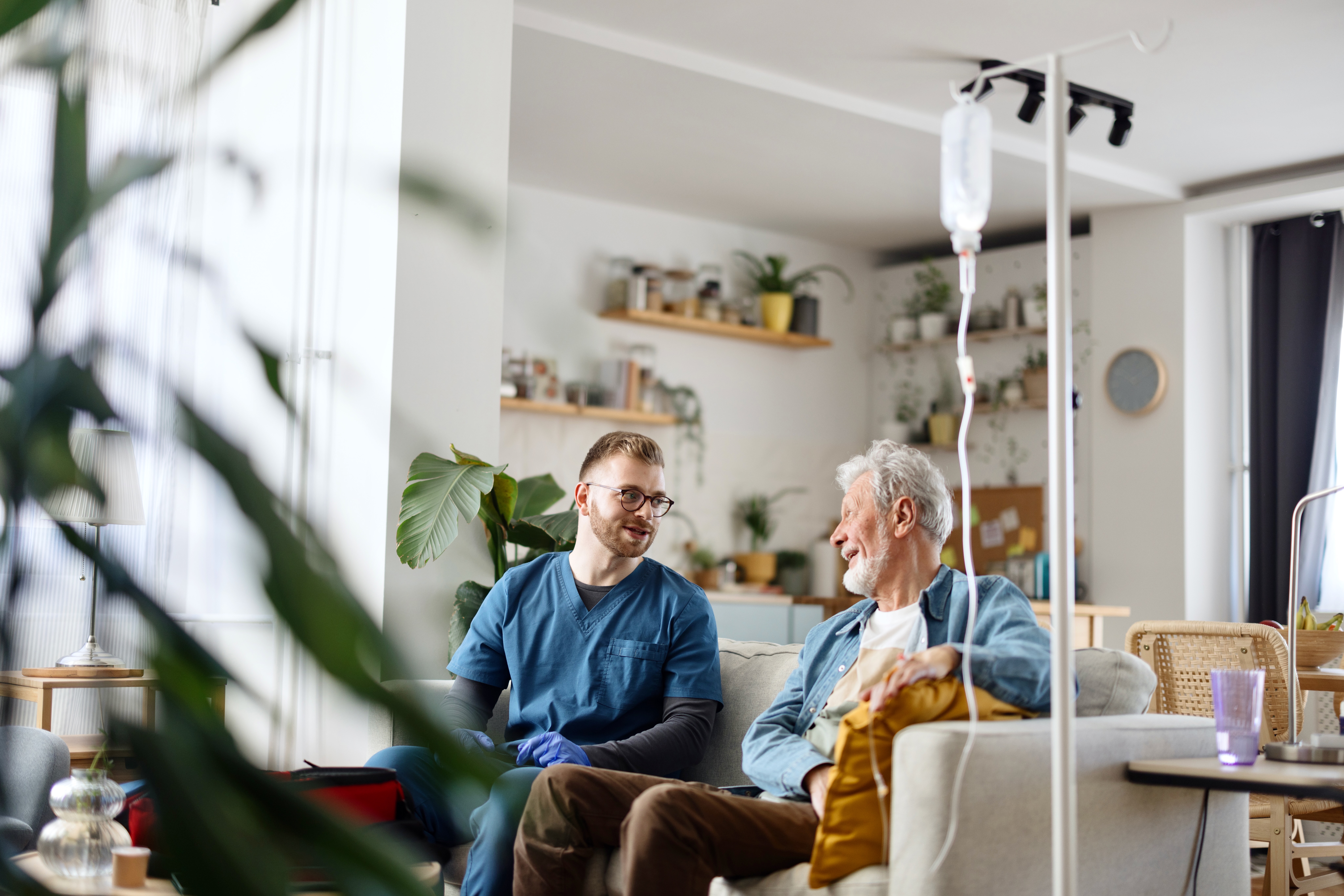 Senior man talking with his caregiver